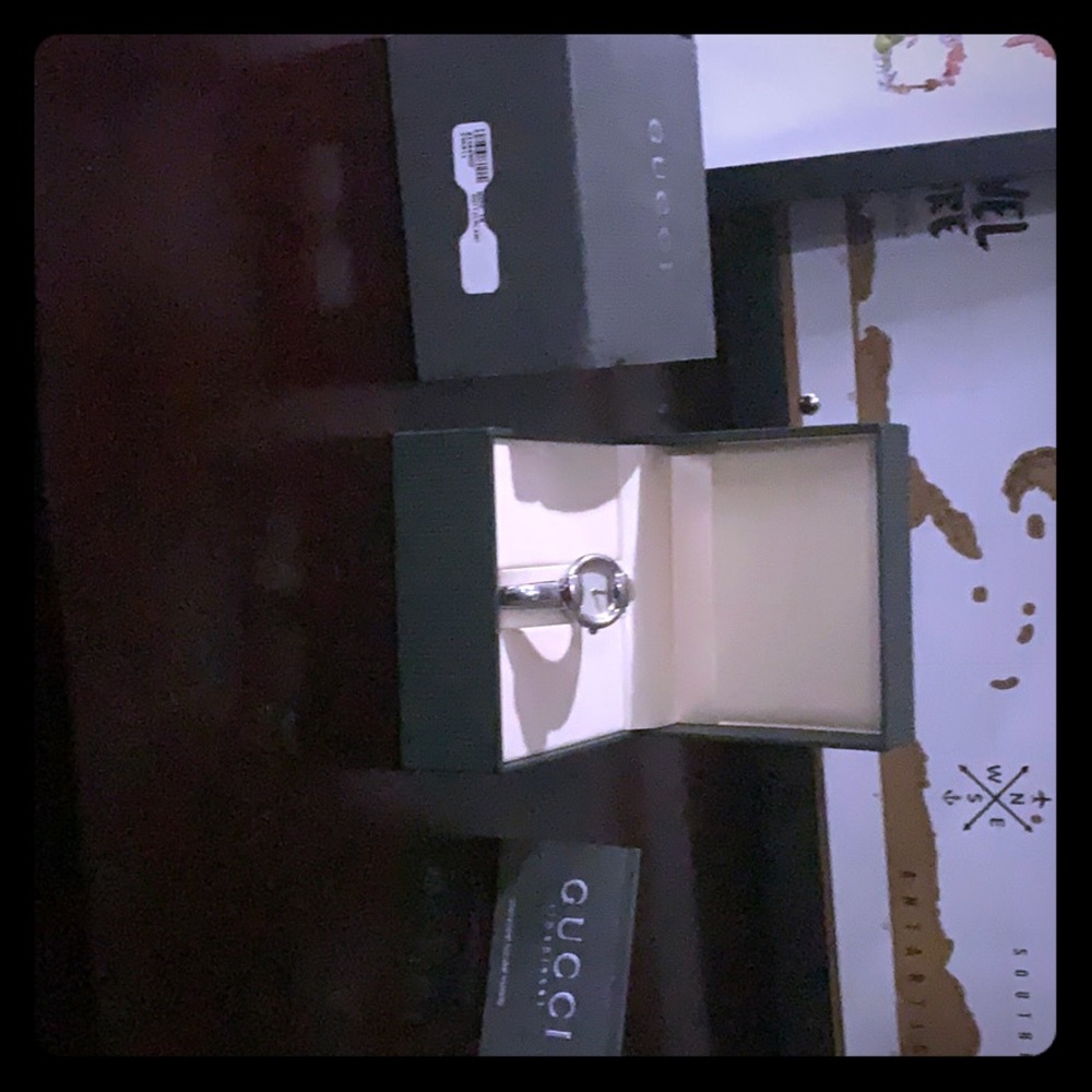 Silver Gucci watch complete with original box.
